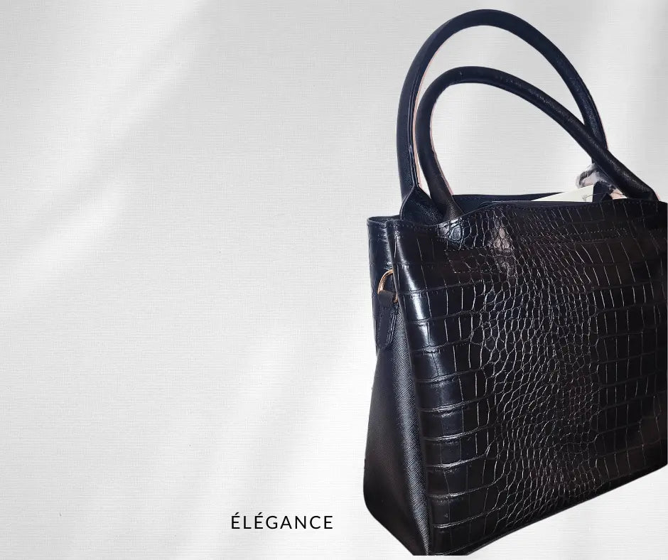 sac à main Manoukian, sac à main femme noir, sac à main bleu canard, sac à main avec bandoulière amovible, sac à main élégant et pratique, sac à main tendance 2024, sac à main prix réduit, sac à main mode femme, sac à main synthétique, sac femme porté main, sac à bandoulière réglable femme, sac à main soldé, sac à main compartiment zippé, sac main femme noir