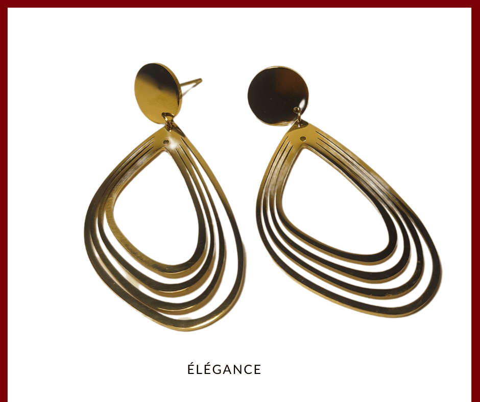Boucles pendantes ovales dorées en acier inoxydable, parfaites pour un look chic et raffiné.