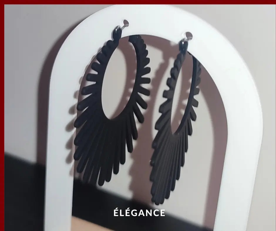 Boucles d’oreilles créoles noires design radial, style chic et moderne pour femme