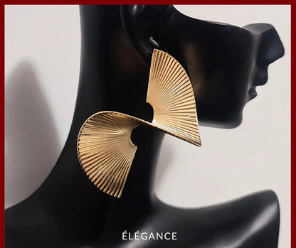 Boucles d'oreilles créoles spirale dorées oversize – Élégance Simplement, bijoux tendance pas chers pour femme, accessoires mode incontournables