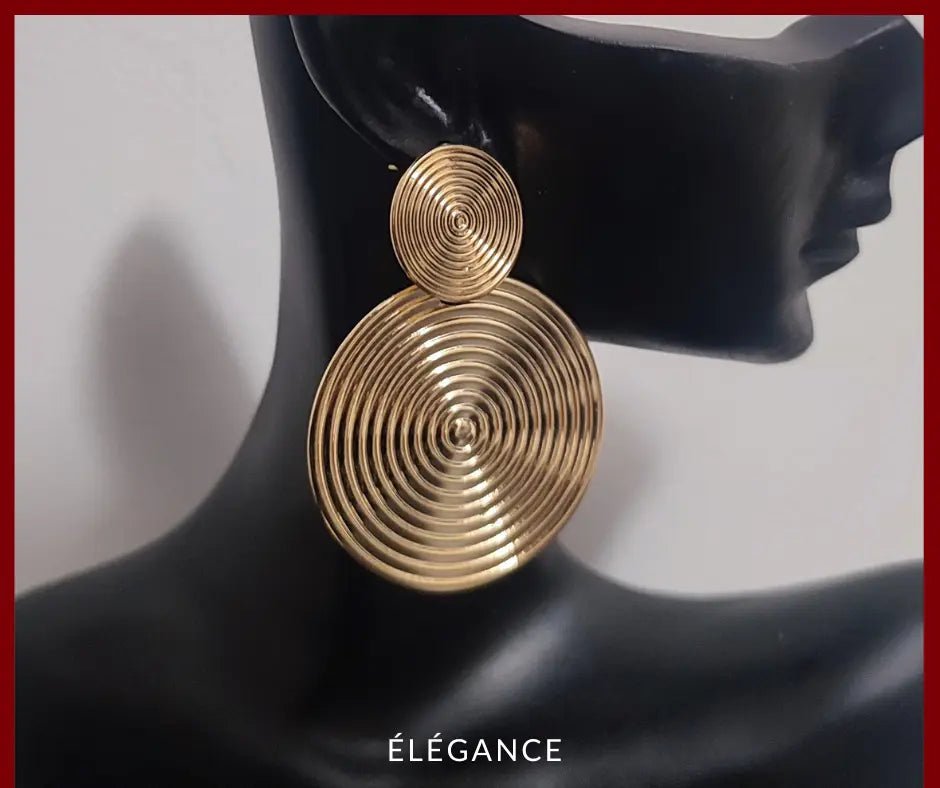 Boucles d'oreilles spirale dorées surdimensionnées, style vintage et élégant.