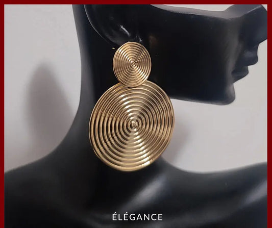 Boucles d'oreilles spirale dorées surdimensionnées, style vintage et élégant.